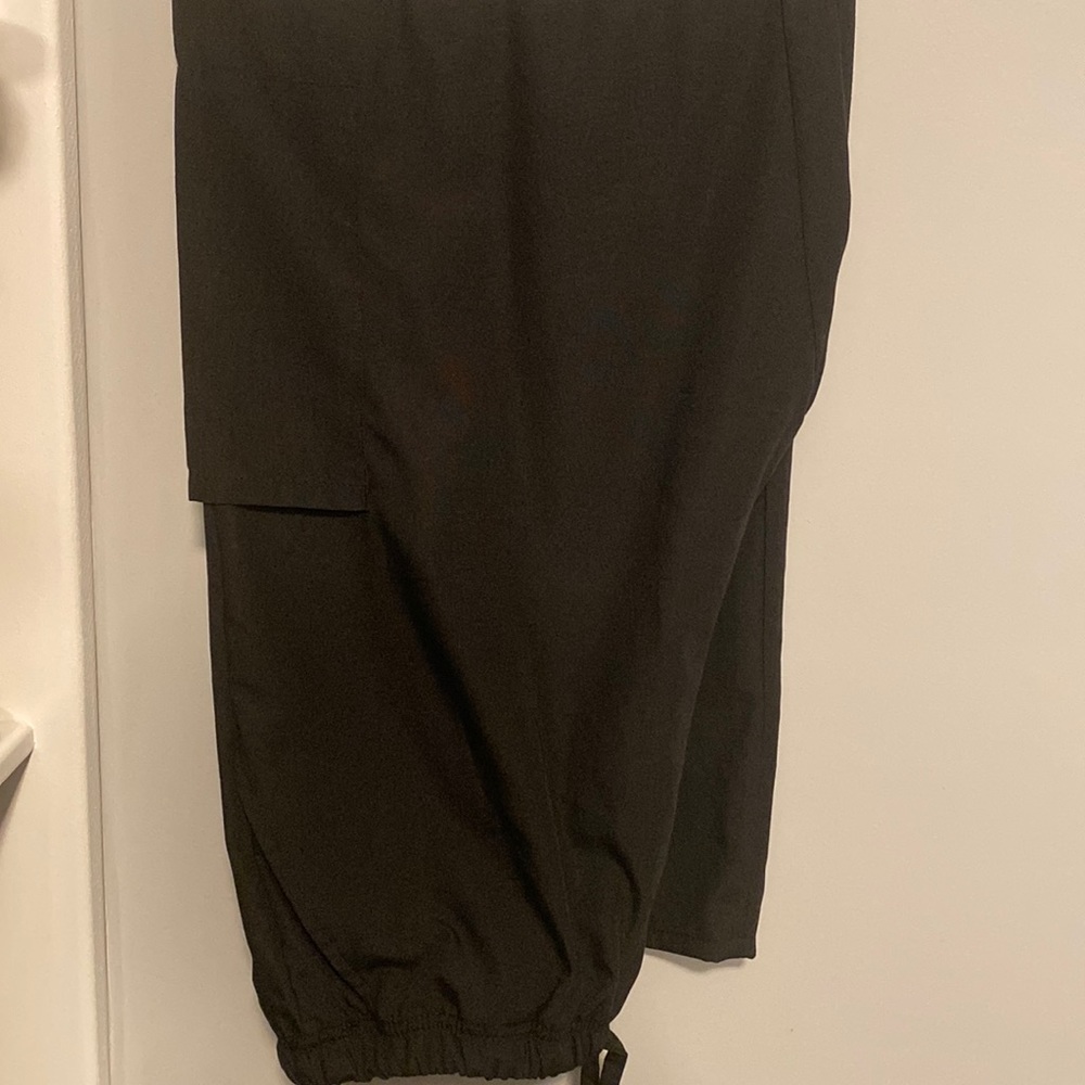 Black scrub pants. Drawstring closure.